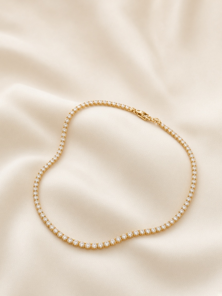 Diamond necklace arranged in a soft loop on ivory silk