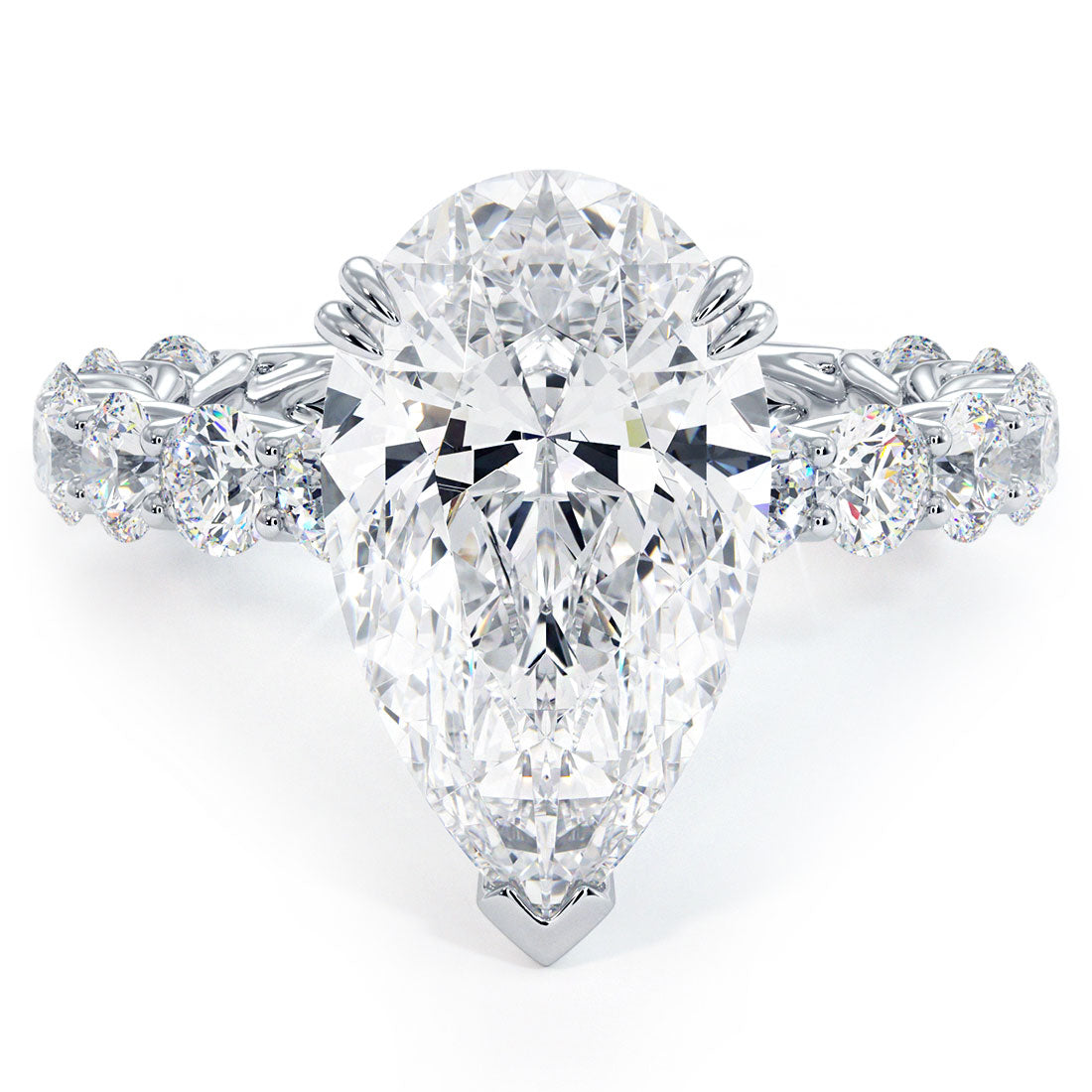 Pear diamond ring with marquise and round stones along the band